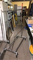Chrome clothes rack on four wheels 57 tall by 52