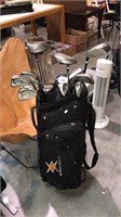 One newer design black golf bag by Ergonomix with