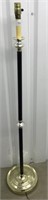 Black, silver and brass colored floor lamp