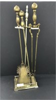 Brass and bronze colored fireplace tools