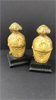 Gold and black helmet bookends