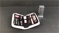 Lot of pink tool kit and silver colored lighter