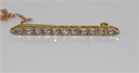 14ct two tone gold and 11 diamond bar brooch