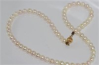 Matinee length baroque pearls with 14ct gold clasp