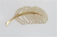 Vintage pearl enhanced feather shaped brooch