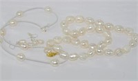 Two pearl necklaces with a set of earrings