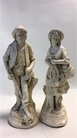 Set of two white ceramic statues