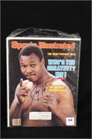 Larry Holmes autographed sports illustrated