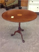 Ball and claw inlaid oval top center table