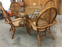 Rattan glass top table with four chairs