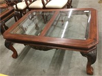 Glass top coffee table with ball and claw feet