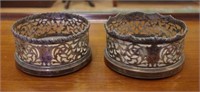 Two antique silver plated bottle coasters