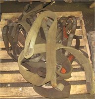 Pallet grouping of various sling lift straps.