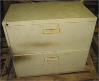 Metal 2 drawer filing cabinet. Measures: 26.5" T