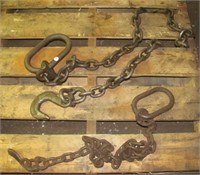 (2) rigging chains with single hooks.