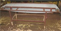 Shop conveyor table on steel base. Measures 80"