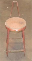 Metal shop stool with back. Measures: 2ft tall.