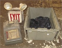 Plastic tote with Exit sign and adding machine.