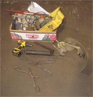 Box of various tools that includes, grease guns,