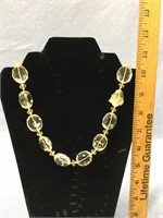 A beautiful faceted crystal necklace and earring s
