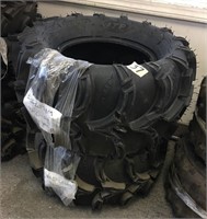 A pair of Mud Lite ITP 4-wheeler tires 25x12.00-12