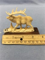 A fabulously carved 3" bull elk, carved on antler,