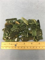 A bag of polished Alaskan jade pieces      (2)