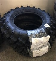 A pair of Swamp Lite 4-wheeler tires AT28x9.00-14