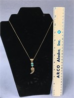 Choice on 2 (32-33): A signed .925 claw pendant an