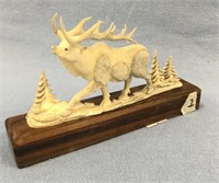 5" antler carving of an elk mounted on walnut, imp