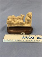 4" antler carved bear scene mounted on walnut    (