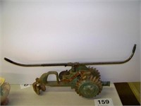 Tractor style traveling lawn sprinkler