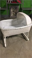 Vintage white decorative bassinet on casters