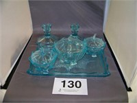Six piece turquoise glass dresser set