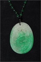 Green Necklace with carved pendant