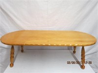 Solid maple oval pie crust edge coffee table on