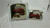 2 Ertl toy Farmall tractors
