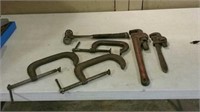 Clamps pipe wrenches and hammer