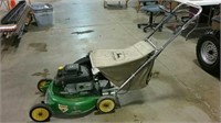 John Deere self-propelled lawn mower with bagger.