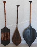 THREE 20TH C. CARVED WOODEN PADDLES FROM THE
