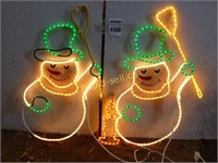 Two Lite Snowmen With a Candle