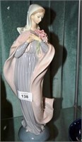 Tall Lladro figuine of a woman holding a posy