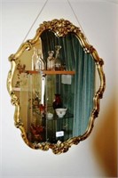 Gilt ornately framed wall mirror, 65cm T