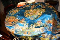 Chinese silk tablecloth, intricate detail on a