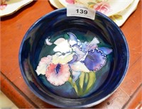 Moorcroft pottery bowl 'Orchid' pattern on a blue