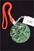 Dark green jade pendant, with carved dragon