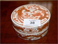 Small Chinese circular porcelain box with iron red