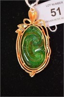 18ct gold & diamond mounted jade pendant,