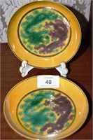 Pair of Chinese yellow dishes, each with