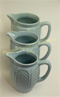 THREE GRADUATED ROBINSON BLUE QUILTED JUGS